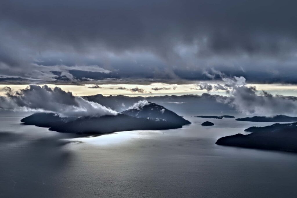 Sunset, seen from Tunnel Bluffs, casting an eerie shadow over the islands.
