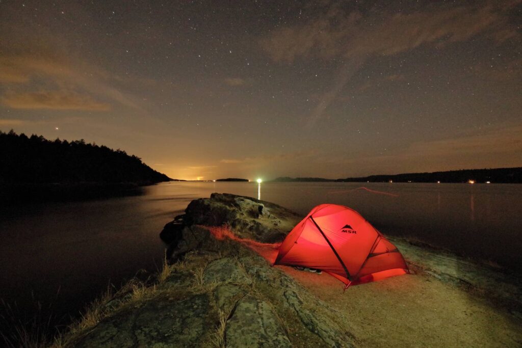 Chivers Point Campground at night with the tent lit up.
