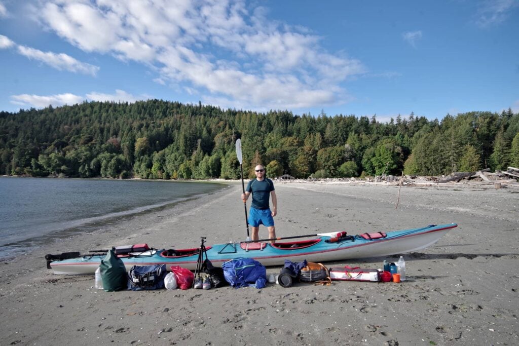A tandem kayak with all camping gear for 3 days laid out.