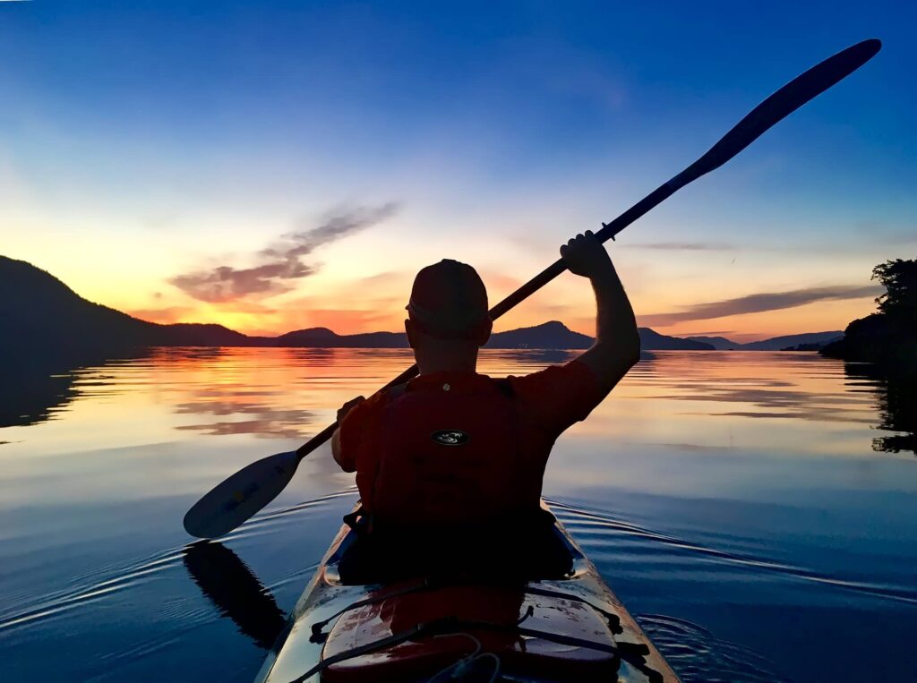 Sun set colours at 5.30am whilst kayaking across the bay