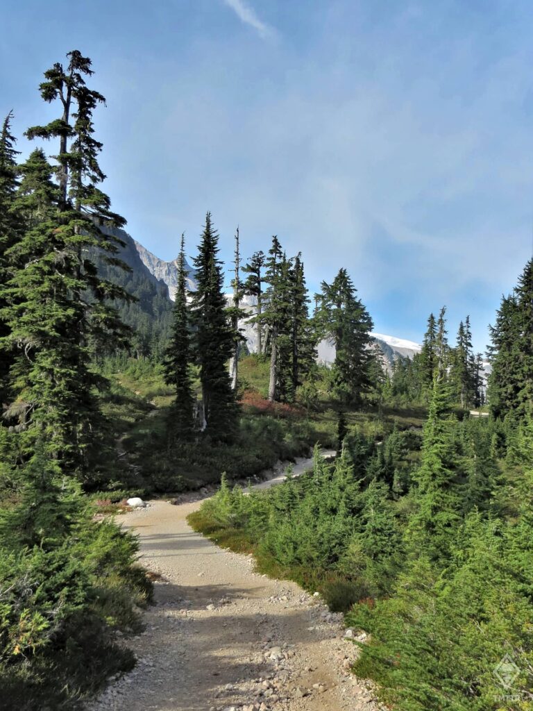 The path continues past Elfin Lakes and into the valleys beyond.